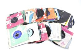 A collection of vintage 7" vinyl 45 RPM single records.
