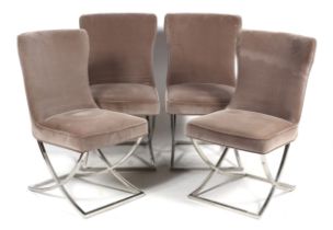 A set of four contemporary velvet upholstered chairs.