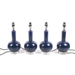 India Jane Altea, a set of four contemporary blue glass table lamps.