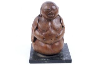 A vintage carved wooden Buddha.