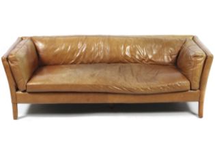A Sandi three seater tan leather sofa.