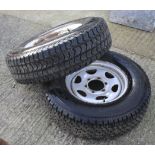 Two spare truck wheels with Bridgestone tyres.