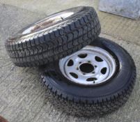 Two spare truck wheels with Bridgestone tyres.