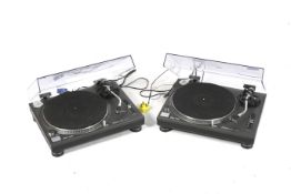 A pair of Technics record deck turntables.