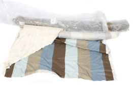 Three rolls of fabric. Including a length of brown, grey and blue striped fabric, L8.
