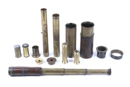 A brass extending telescope and other components. Including lenses, extending sections, etc.