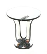 An India Jane Aston round mirror top lamp table (RRP £595).