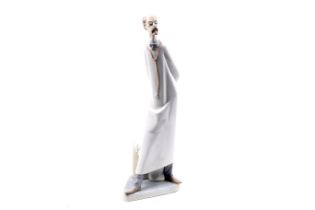 A Lladro porcelain figure of a doctor.