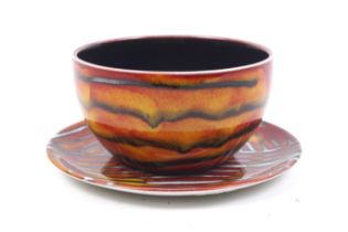 A signed Anita Harris studio pottery tea bowl and saucer.