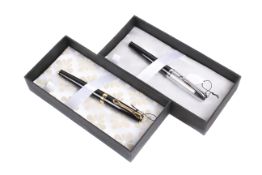 Two Diplomat Excellence black fountain pens. Cased and boxed.