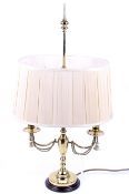 A 20th century brass two-light candelabra table lamp.