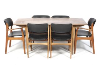 A mid-century dining table and a set of Danish chairs.