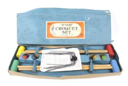 A boxed 'Junior' croquet set.