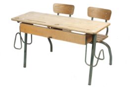 A vintage twin school desk. With built in seats and tubular metal frame.