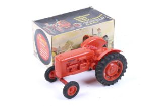 A Pippin Toys Nuffield model tractor. In plastic with rubber tyres and original box.