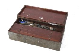 A vintage wooden toolbox and contents.
