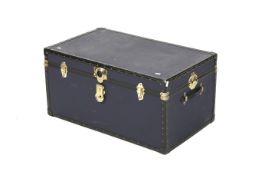 A blue contemporary travel trunk. Of rectangular form with brass catches.