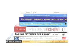 Eight assorted photography books.