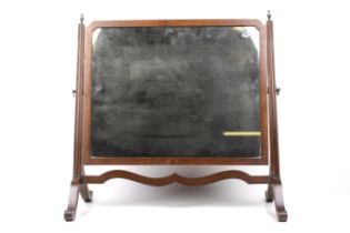 A vintage mahogany swing dress mirror.