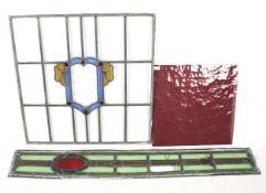 Two vintage leaded stained glass window panels and a square panel of red textured glass. Max.