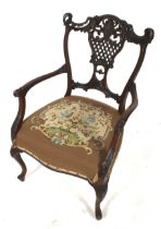 A Victorian elbow chair.