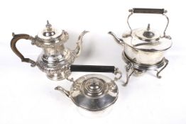 A silver plated copper tea pot and tow tea kettles.