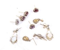 Four pairs of vintage 9ct gold and gem set earrings and with two single earrings. 6.