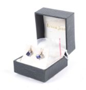 A pair of vintage 9ct gold, rectangular synthetic-sapphire and tiny diamond stud earrings.