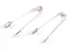 Two small silver sugar tongs.