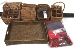 Four wicker baskets and a picnic blanket. Including one fitted to carry six bottles, Max.