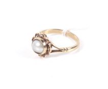A vintage 9ct gold and cultured-half-pearl single stone ring. The 7.