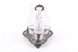 A silver-plated three-bottle decanter strand and three clear glass decanters and stoppers.