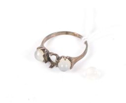 An early 20th century gold and round cabochon moonstone three stone ring.