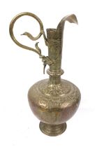 An Asian brass ewer.