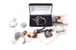 A gold-plated open face keyless pocket watch and a small collection of jewellery.