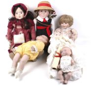 An assortment of bisque head dolls. Including 'Alresford Royal Baby', etc. With four original boxes.