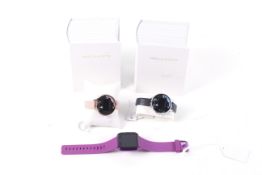 Three lady's fitness tracker smart watches by Fitbit and Amelia Austin.