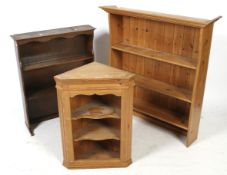 Three pieces of wooden furniture. Comprising two wall shelves and a corner cabinet. Max.