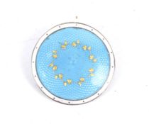 An Edwardian silver and pale blue guilloche enamelled round brooch.