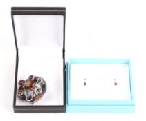 A pair of 18ct white gold, ruby and diamond earrings and a Scottish pebble brooch.