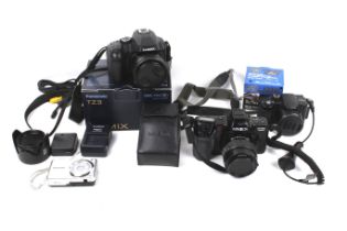 An assortment of cameras. Including a Panasonic TZ3 a Minolta Dynax 7000i, etc.