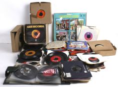 A collection of assorted 7" 45 RPM vinyl singles.