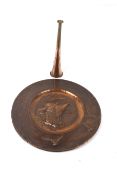 A copper tray and hunting horn.