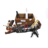 A box of assorted hand tools. Including a wet stone, etc.