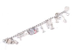 A silver curb link 'charm' bracelet on a bolt-ring clasp hung with 17 various charms.