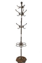 A cast metal coat and umbrella stand.