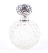 A silver mounted clear cut glass spherical scent bottle.