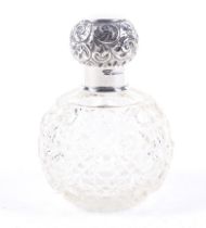 A silver mounted clear cut glass spherical scent bottle.