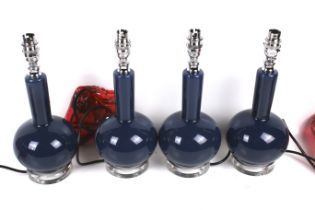 India Jane Altea, a set of four contemporary blue glass table lamps.