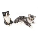 Two small Winstanley china cats. Including a seated size 1 and a recumbent tabby size 3. Max.